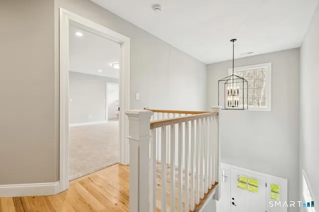 a view of an entryway with wooden floor