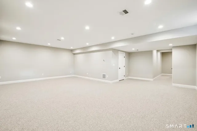 an empty room with a empty space and windows