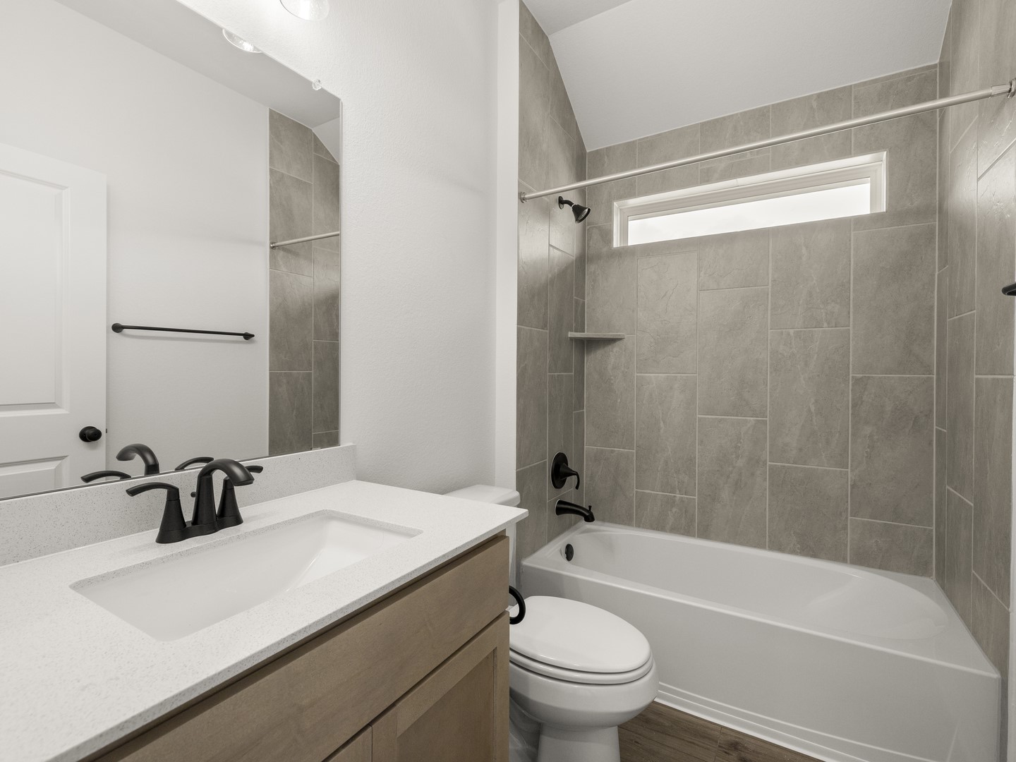 402 Judson Street Bertram, TX 78605 - Photo 19 of 27 a bathroom with a sink mirror toilet and bathtub
