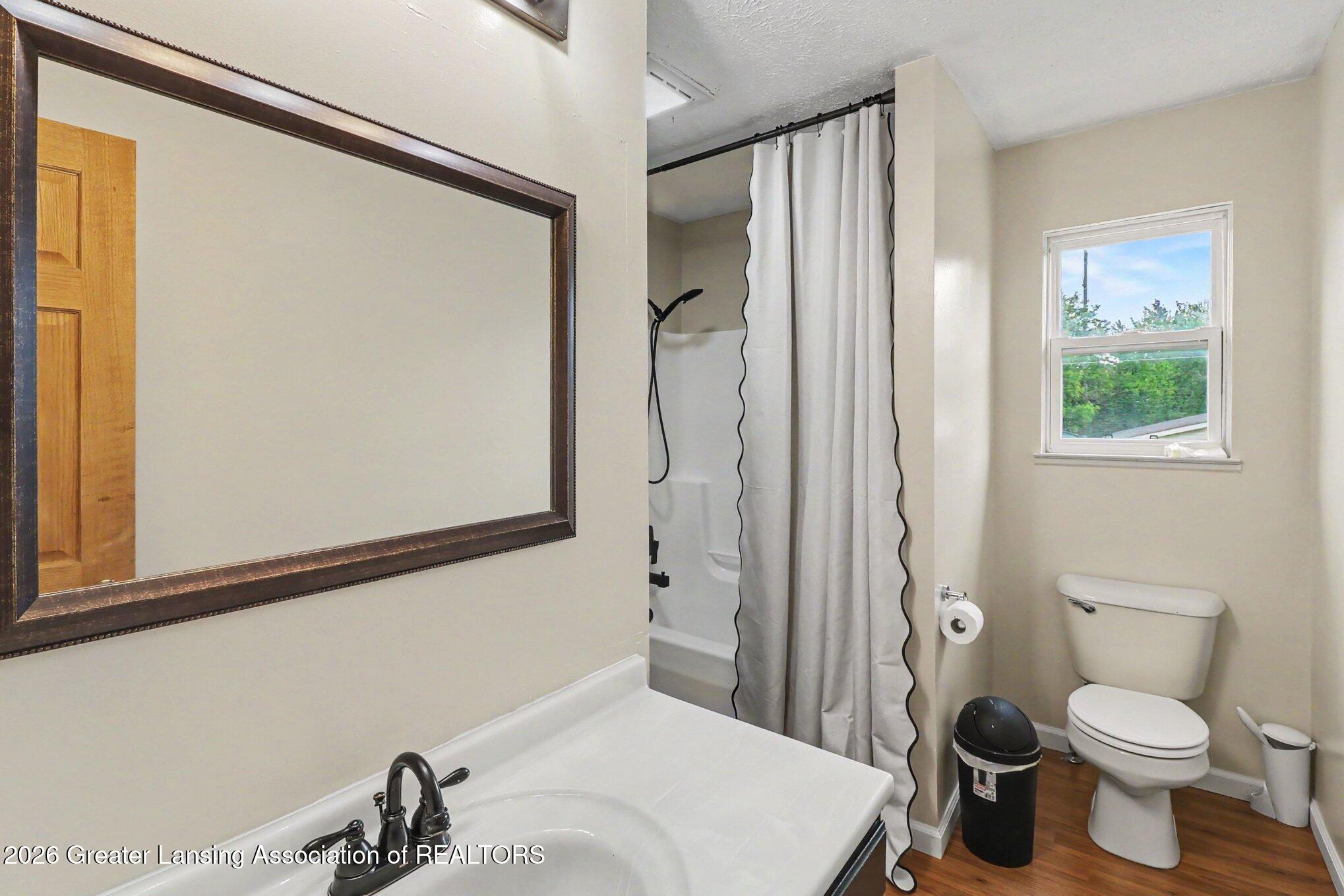 8585 North Gregory Road Fowlerville, MI 48836 - Photo 14 of 26 Upstairs Bathroom