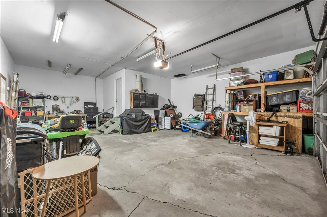 1661 Keefer Road Girard, OH 44420 - Photo 28 of 35 Attached 2.5 Car Garage with a garage door opener and a workshop area