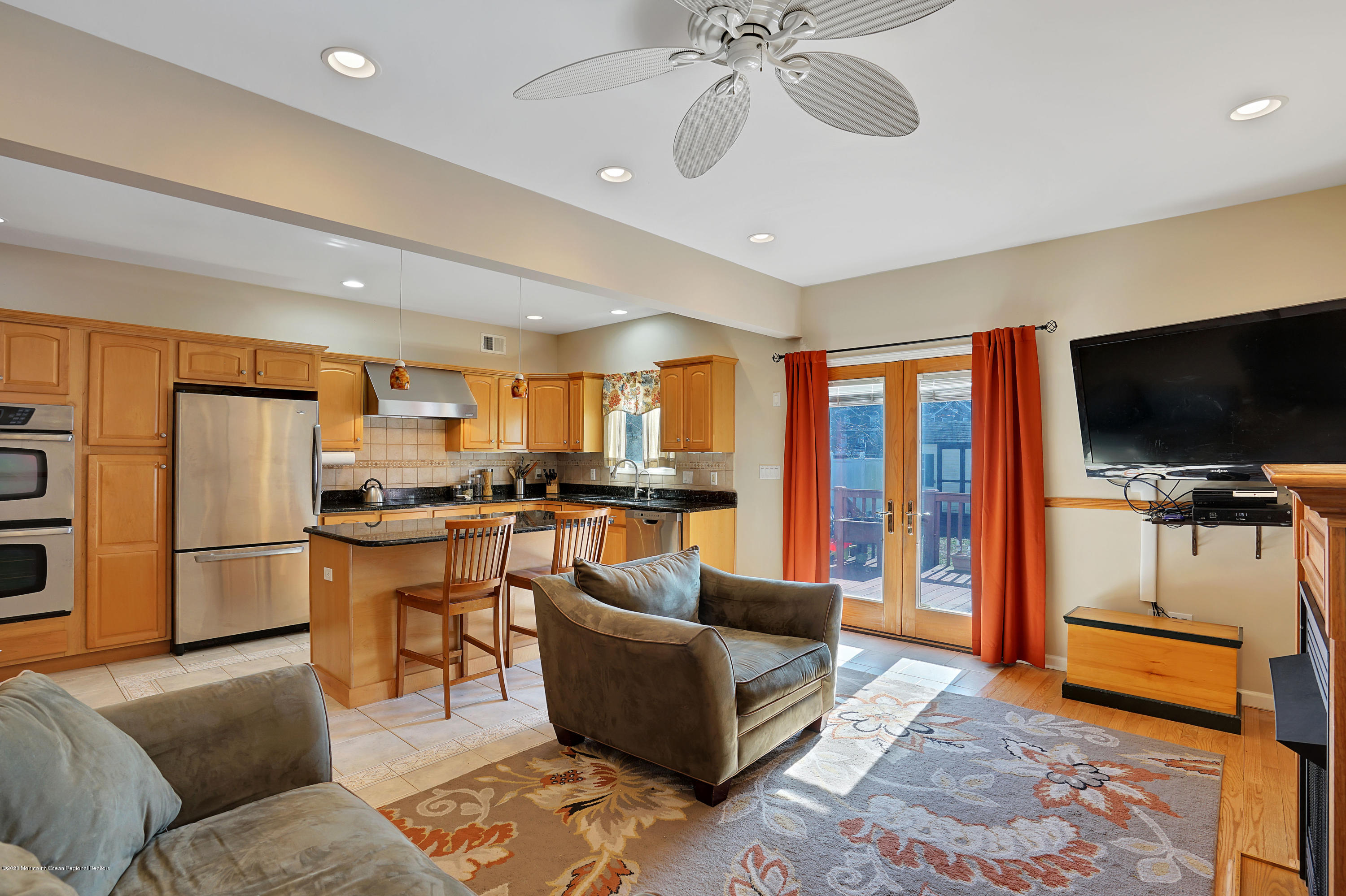 115 Harding Road Red Bank, NJ 07701 - Photo 25 of 43 a living room with furniture and a flat screen tv