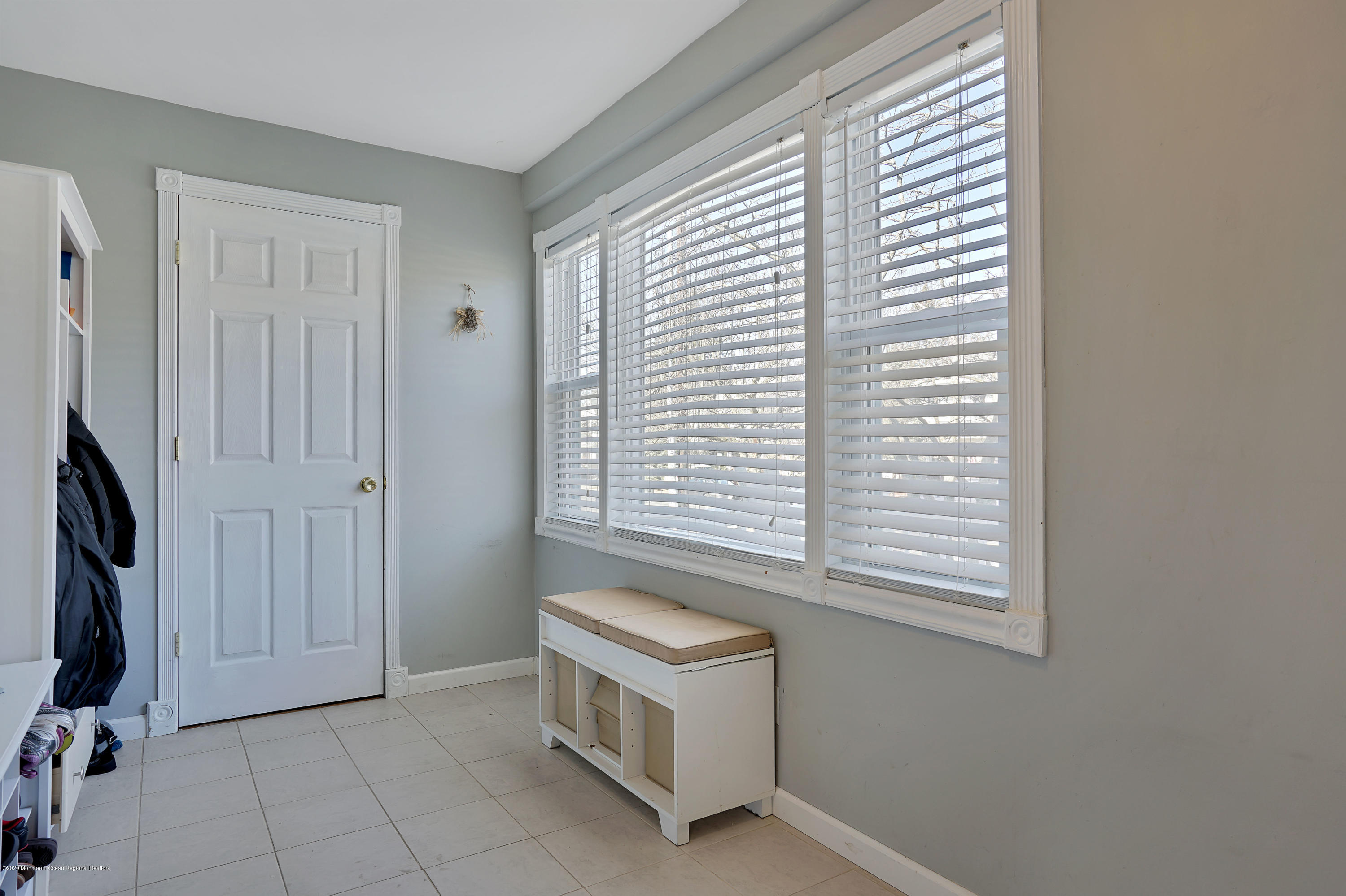 115 Harding Road Red Bank, NJ 07701 - Photo 10 of 43 a room with a chair and a window
