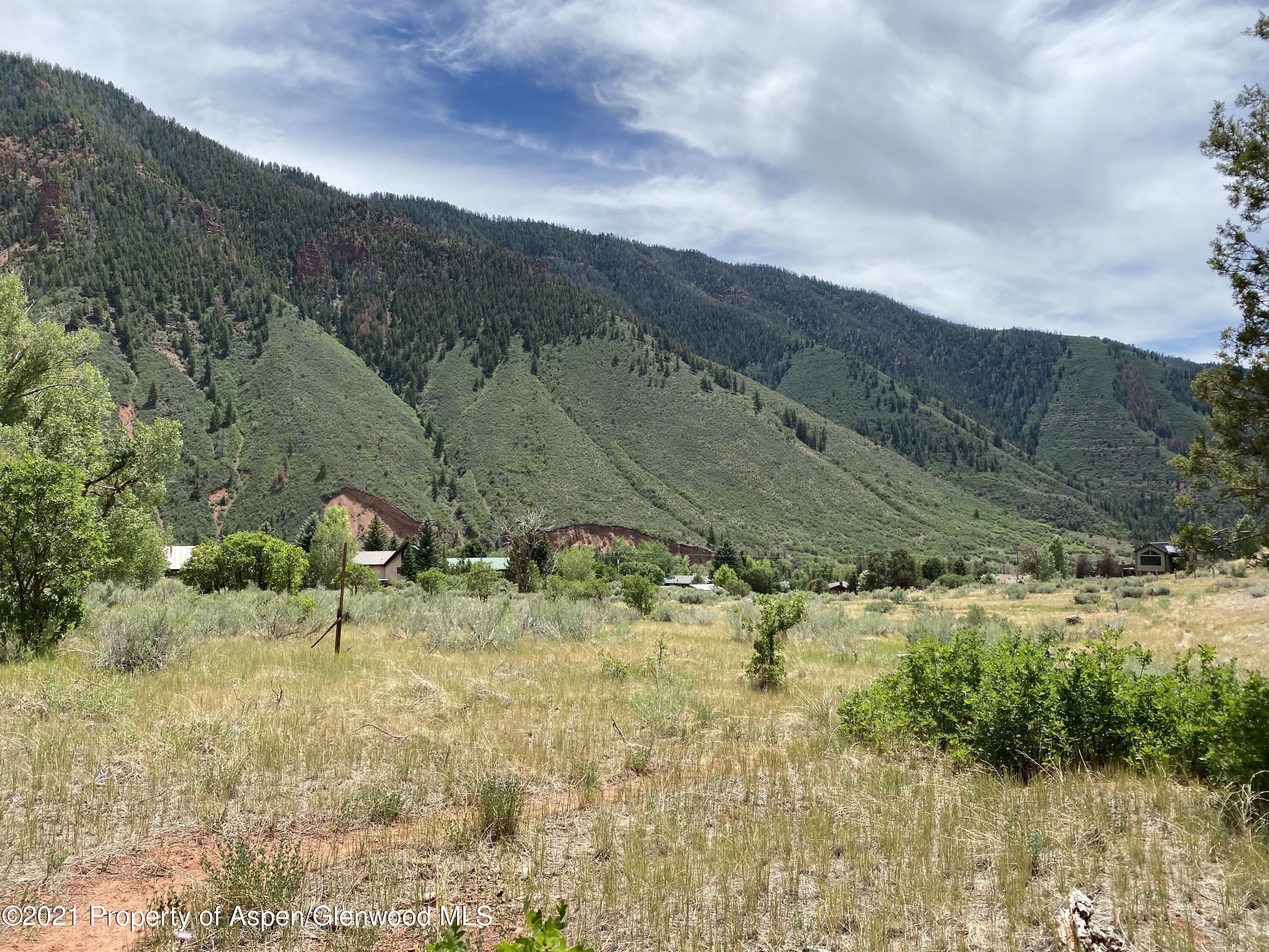 1200 Frying Pan Road Basalt, CO 81621 - Photo 27 of 29 a view of a lake with mountains in the background
