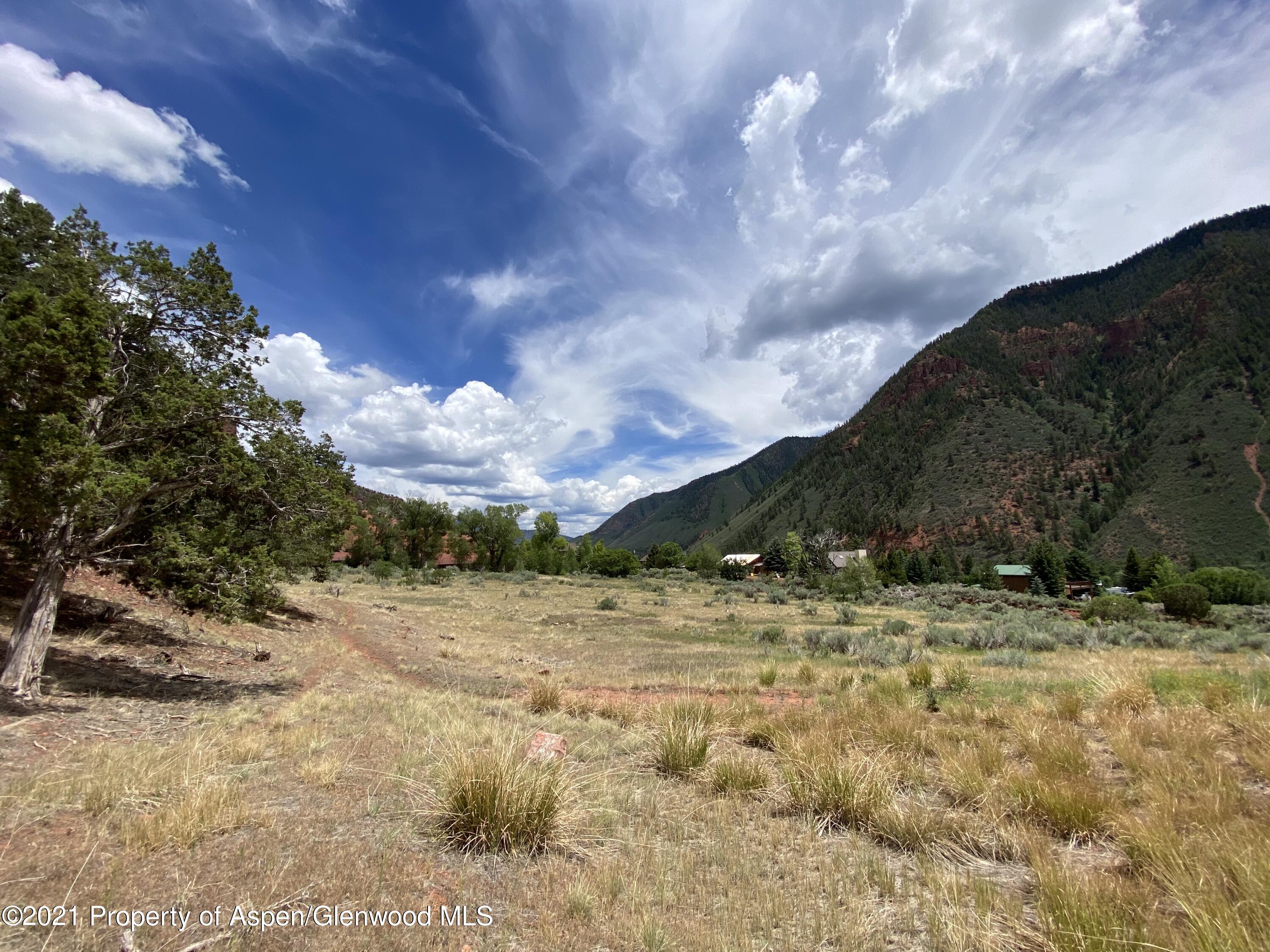 1200 Frying Pan Road Basalt, CO 81621 - Photo 4 of 29 a view of a yard with an empty space and a lake view