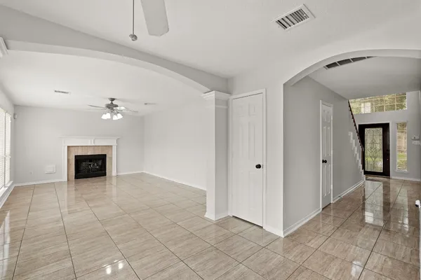a view of an empty room with a fireplace