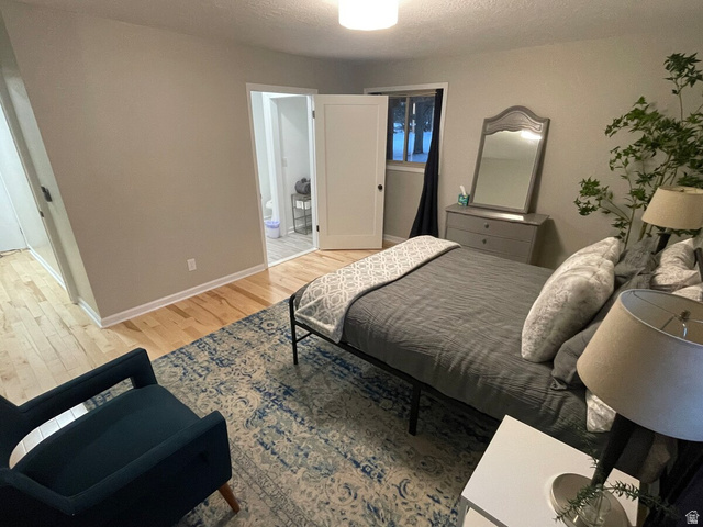 2807 North Ogden Canyon Road Eden, UT 84310 - Photo 22 of 72 Room featuring wood-finish flooring, light neutral wall tones, and a flush-mount ceiling light fixture