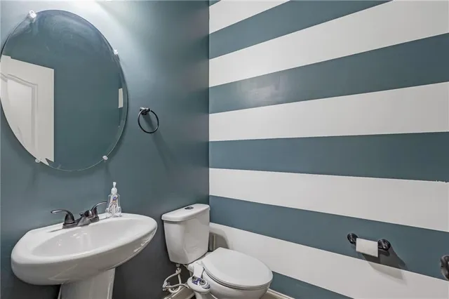 a workspace with chandelier and a window