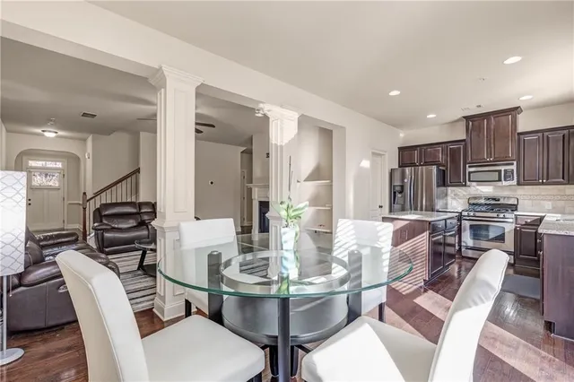 a dining room with furniture and window