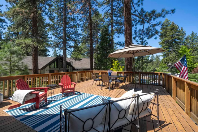 a view of a chairs and table on the deck