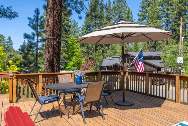 a bedroom with a bed and glass window