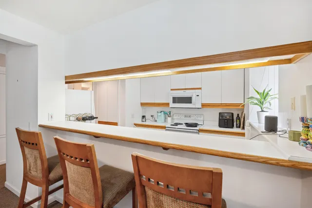 a kitchen that has a sink and a stove