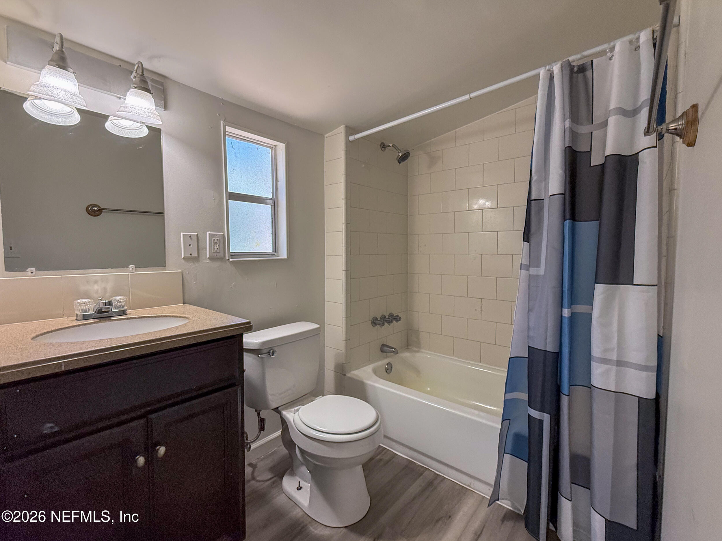 6300 Blanchard Road Jacksonville, FL 32216 - Photo 11 of 12 a bathroom with a sink a toilet and shower