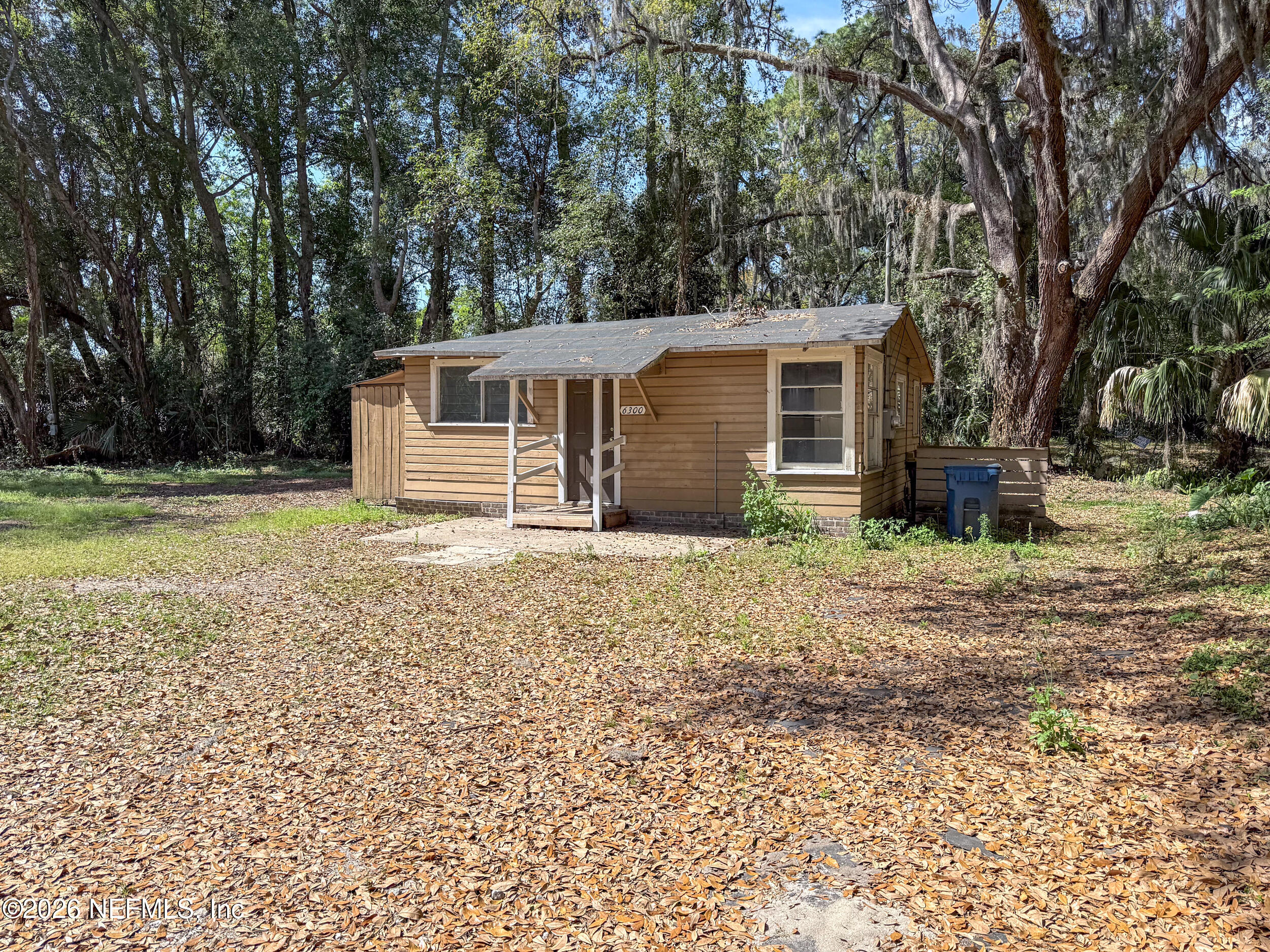 6300 Blanchard Road Jacksonville, FL 32216 - Photo 12 of 12 a house with trees in front of it