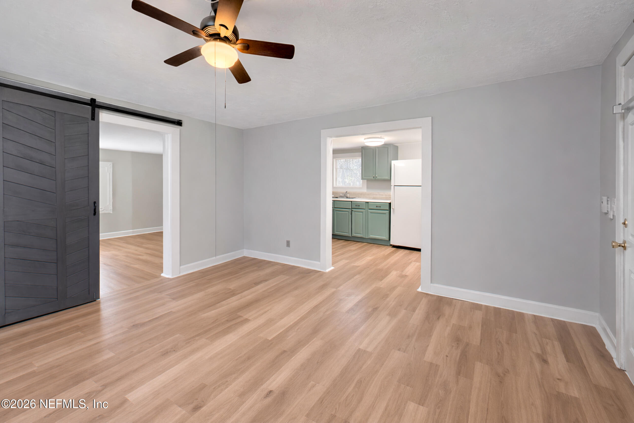6300 Blanchard Road Jacksonville, FL 32216 - Photo 3 of 12 wooden floor in an empty room with a window