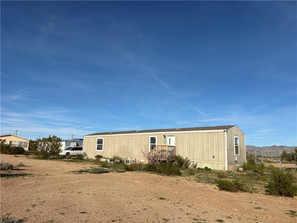 4938 Mormon Flat Road Golden Valley, AZ 86413 - Photo 1 of 23 View of home's exterior with a mountain view