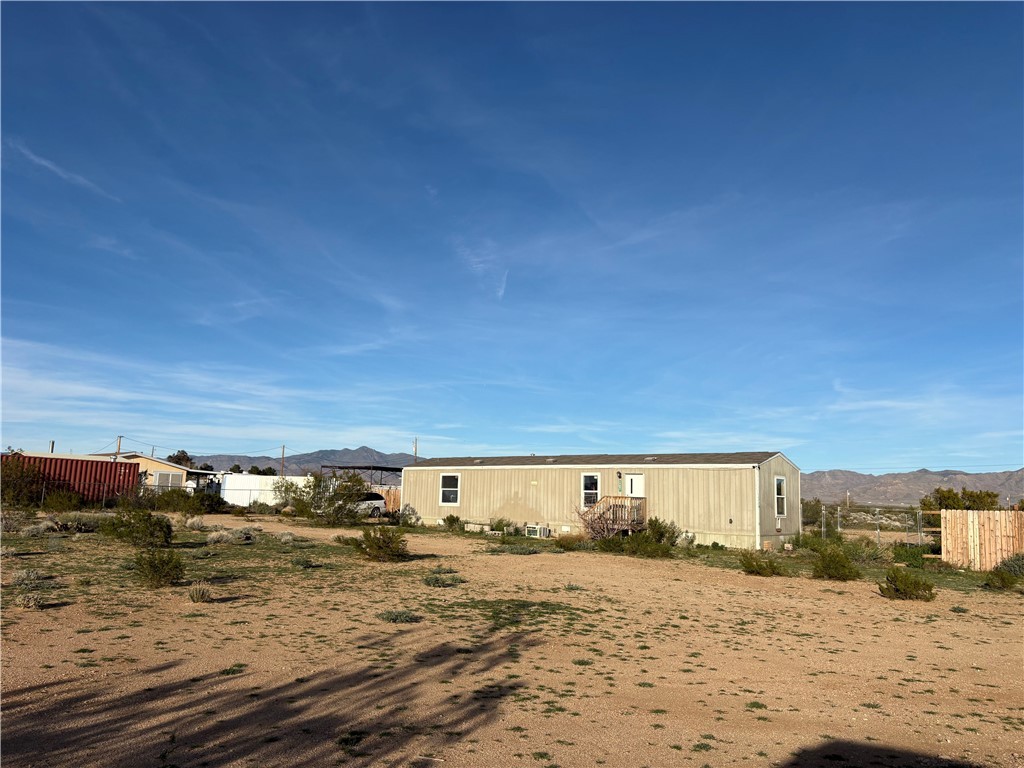 4938 Mormon Flat Road Golden Valley, AZ 86413 - Photo 16 of 23 Rear view of property with a mountain view