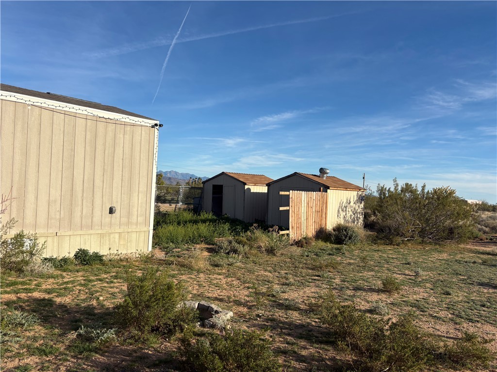 4938 Mormon Flat Road Golden Valley, AZ 86413 - Photo 19 of 23 View of yard with an outdoor structure and a mountain view