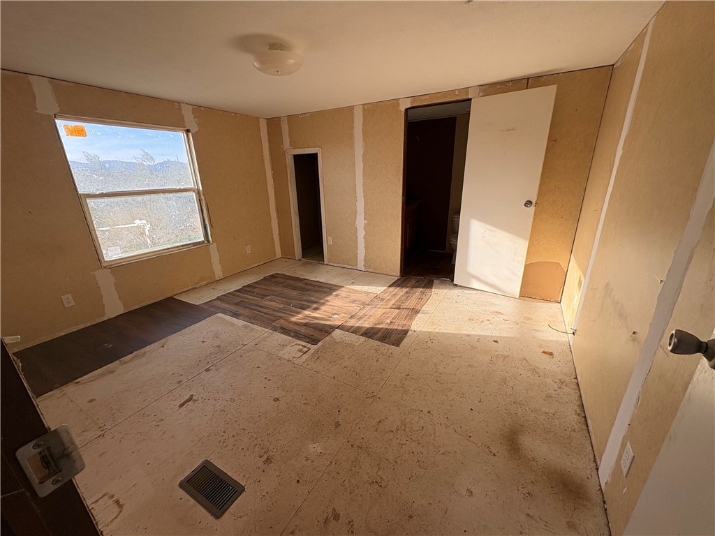 4938 Mormon Flat Road Golden Valley, AZ 86413 - Photo 5 of 23 Unfurnished bedroom featuring a closet