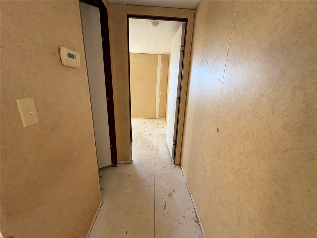 4938 Mormon Flat Road Golden Valley, AZ 86413 - Photo 9 of 23 Hallway featuring concrete floors