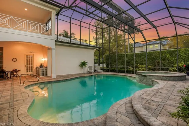 a view of a swimming pool with a patio