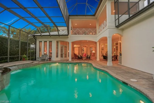 a swimming pool with outdoor seating