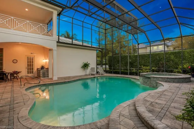 a view of a swimming pool with a patio
