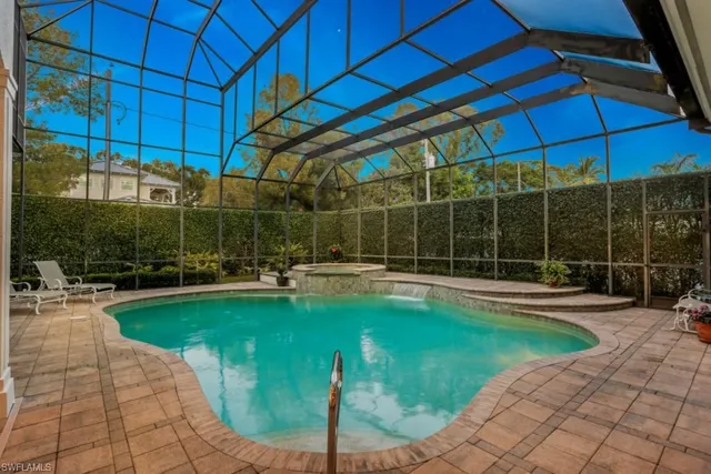 a view of a swimming pool with a patio