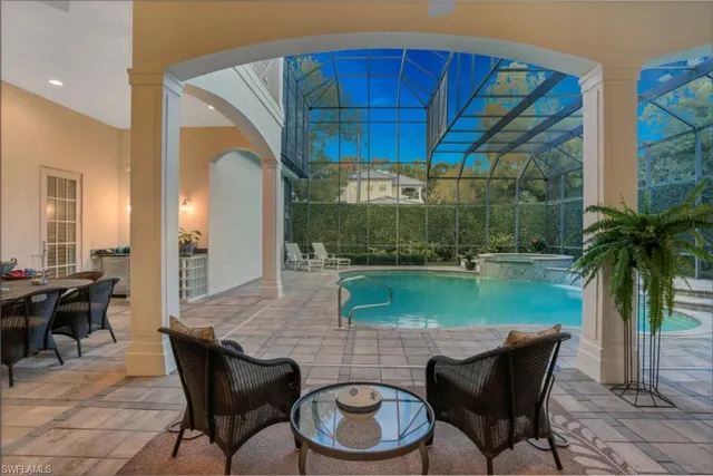 a dining room with a table and chairs