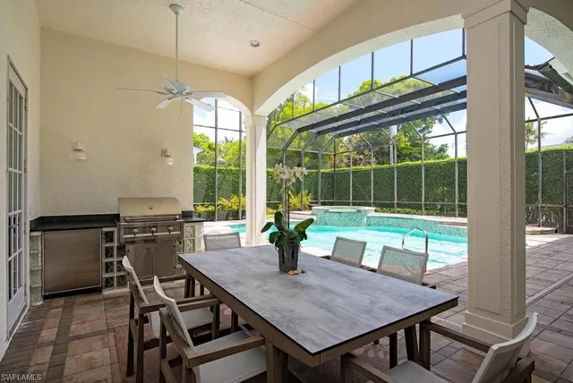 a kitchen with a stove a sink and a table