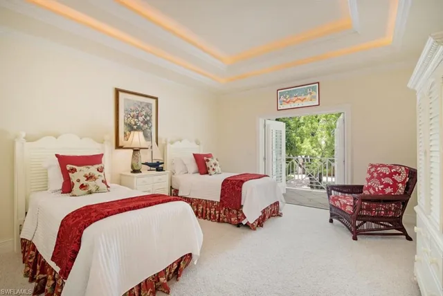 a bedroom with a bed and glass window