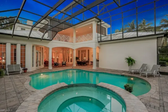 a view of a backyard with swimming pool