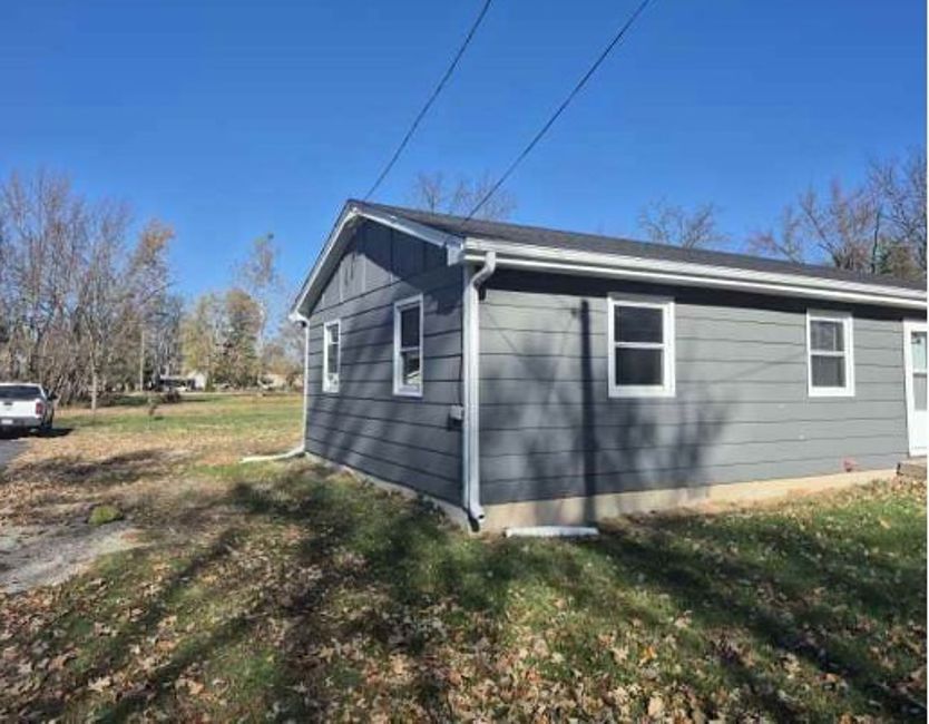 225 Ogden Street Capron, IL 61012 - Photo 3 of 16 a view of a backyard of the house