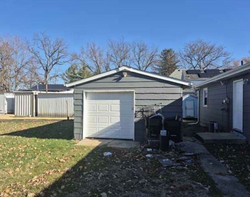 225 Ogden Street Capron, IL 61012 - Photo 5 of 16 a view of a house with a yard