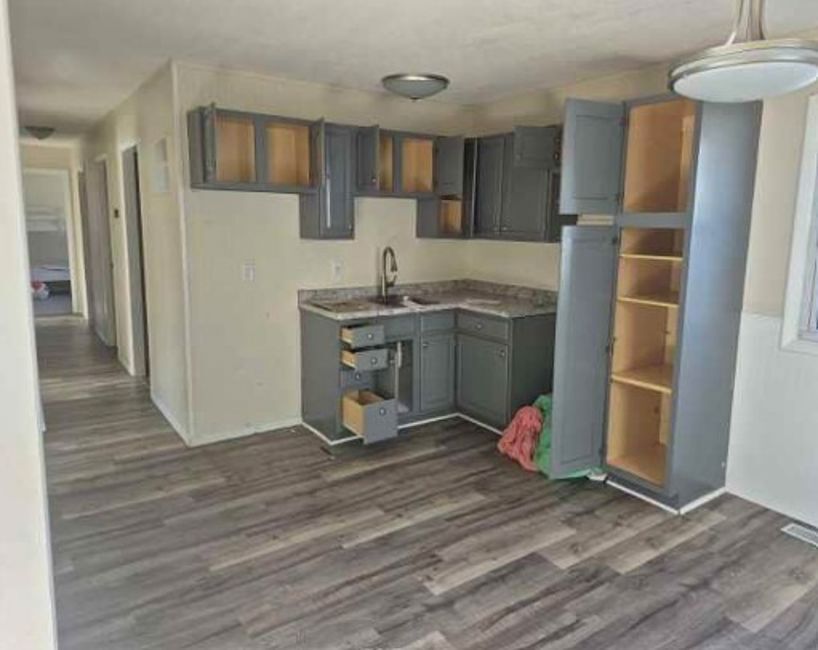 225 Ogden Street Capron, IL 61012 - Photo 7 of 16 a kitchen with stainless steel appliances granite countertop a refrigerator and a stove