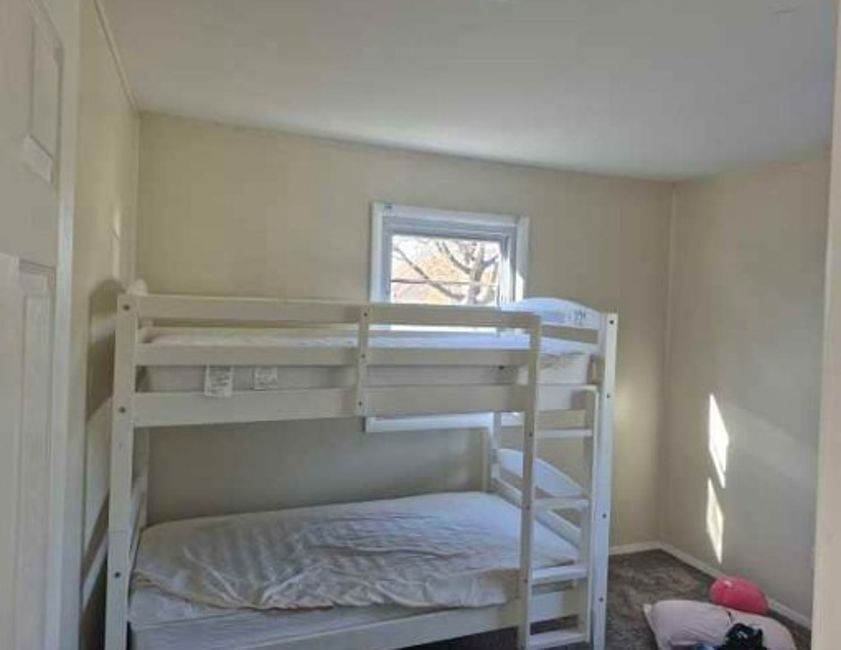 225 Ogden Street Capron, IL 61012 - Photo 9 of 16 a room with a chair and white walls