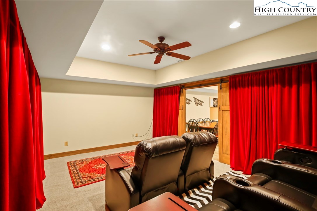 138 South Camp Road, Unit 103 Boone, NC 28607 - Photo 36 of 50 a living room with furniture a flat screen tv and a window
