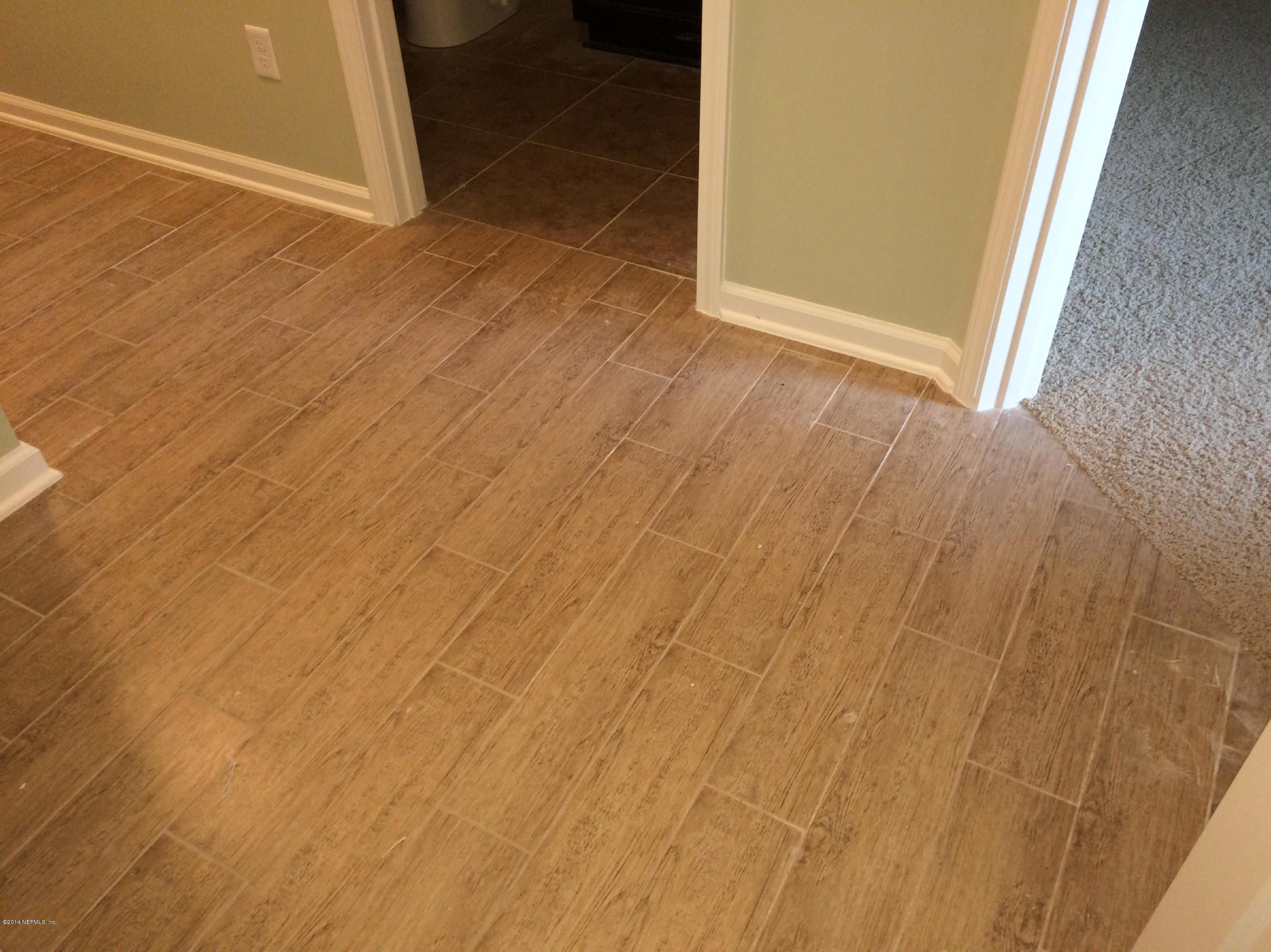 3152 Creighton Landing Road Fleming Island, FL 32003 - Photo 36 of 47 Beautiful wood grain tile floors