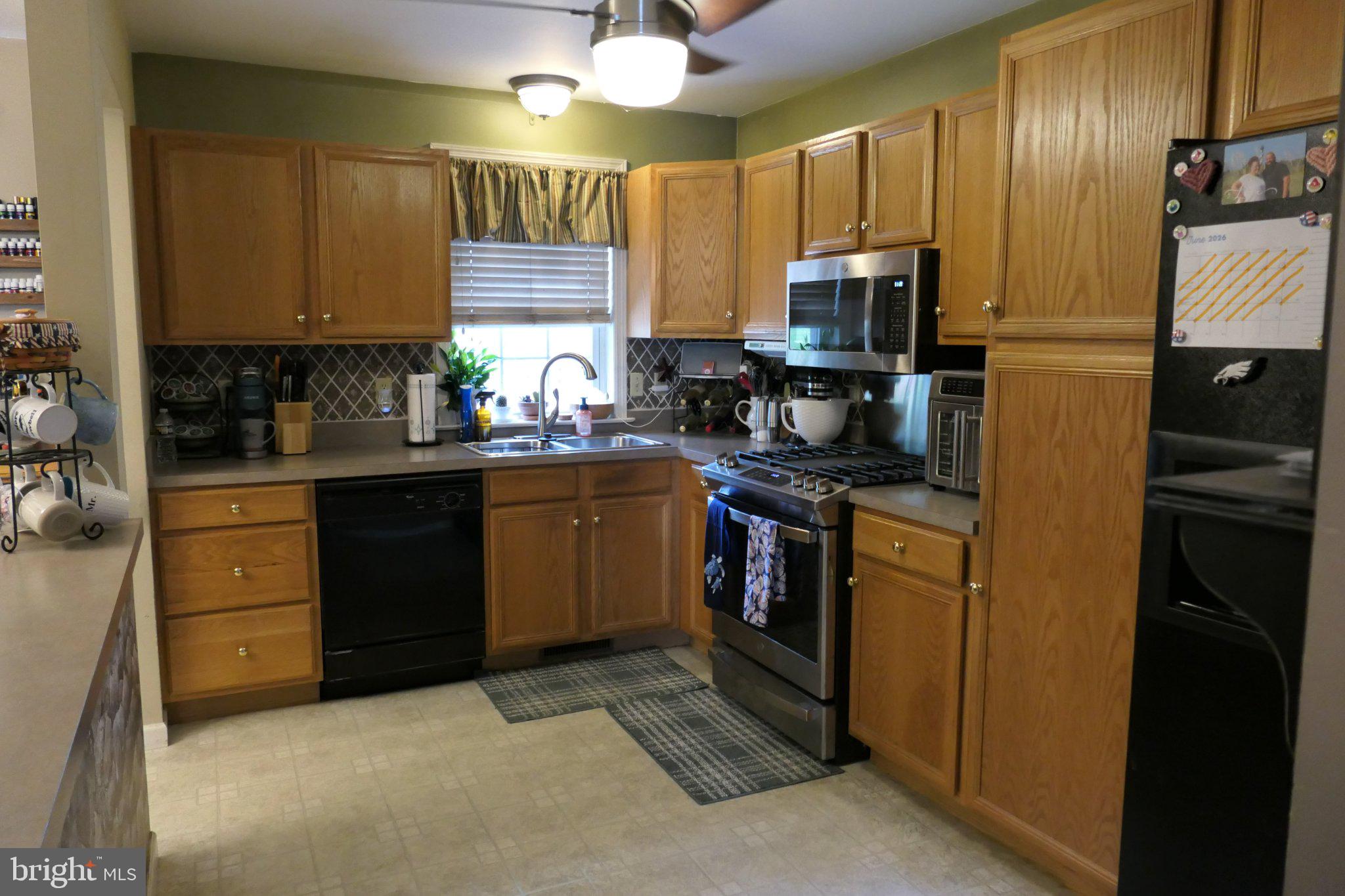 178 Riders Way Lebanon, PA 17042 - Photo 7 of 24 Cozy kitchen with warm wooden tones.