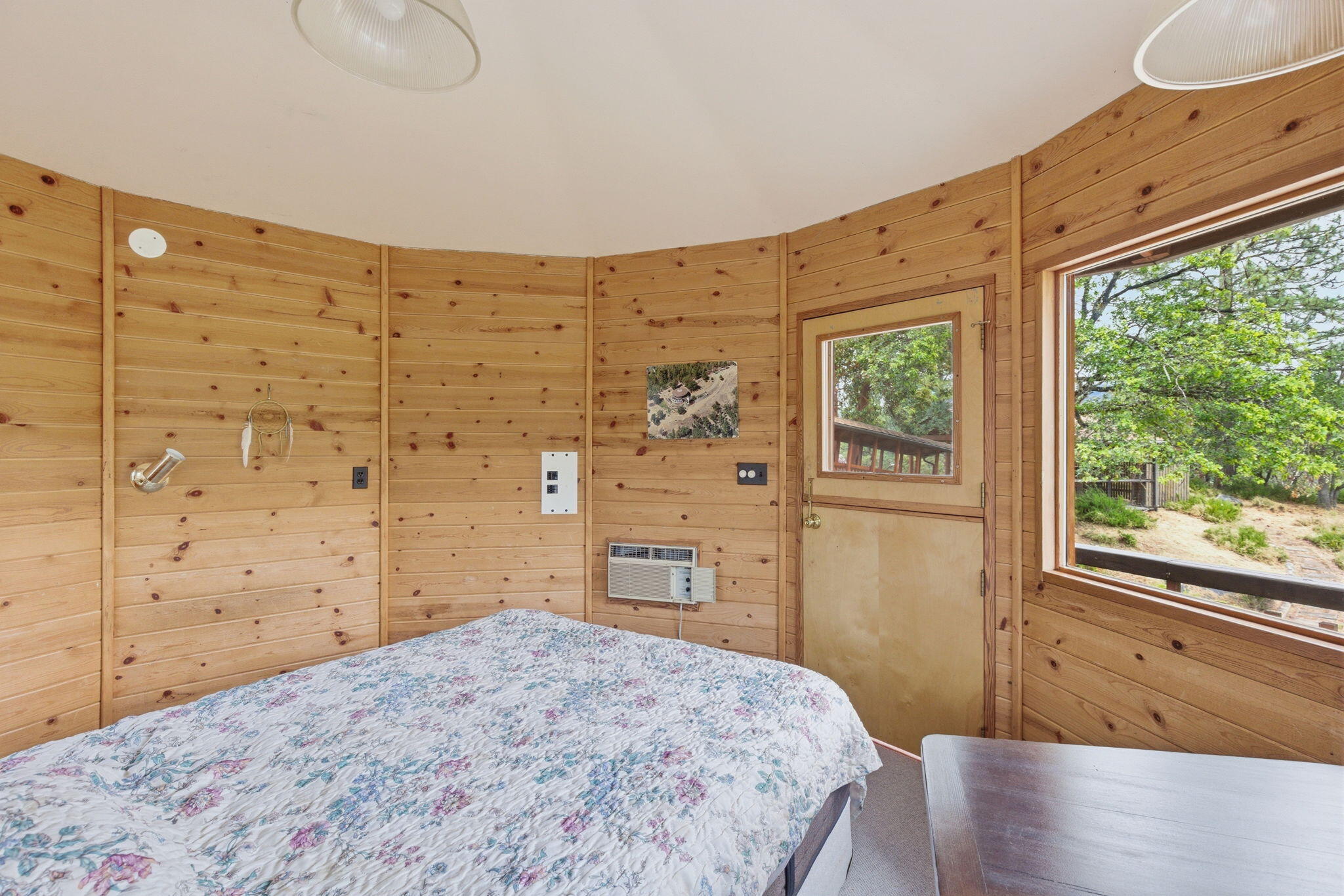 9595 Sterling Creek Road Jacksonville, OR 97530 - Photo 39 of 76 a bedroom with a bed and wooden floor