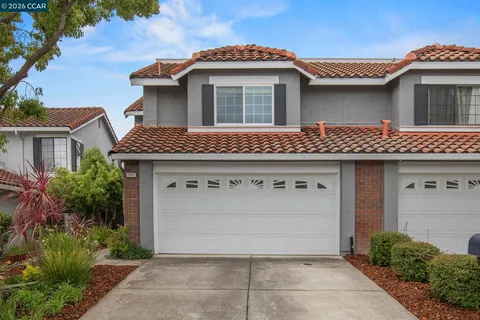 a front view of a house with a garage