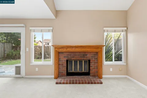 a view of a room with sliding glass door and balcony