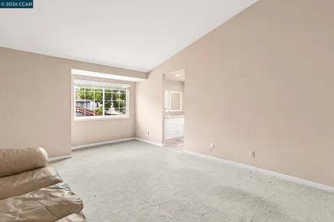 an empty room with closet area