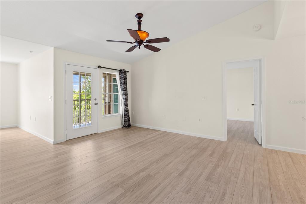 8911 Manor Loop, Unit 208 Lakewood Ranch, FL 34202 - Photo 21 of 49 a view of livingroom with hardwood floor and window