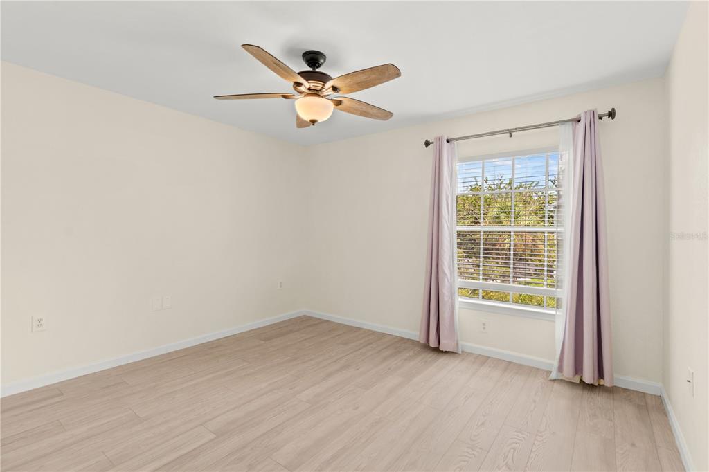 8911 Manor Loop, Unit 208 Lakewood Ranch, FL 34202 - Photo 28 of 49 a view of an empty room with a window