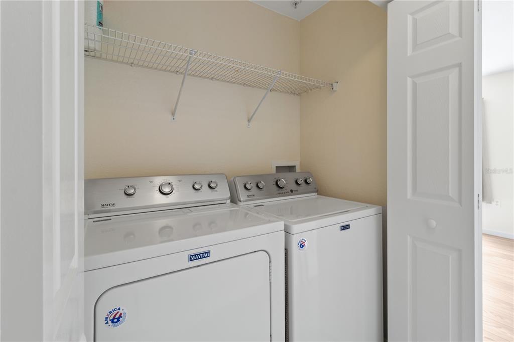 8911 Manor Loop, Unit 208 Lakewood Ranch, FL 34202 - Photo 30 of 49 a utility room with dryer and washer