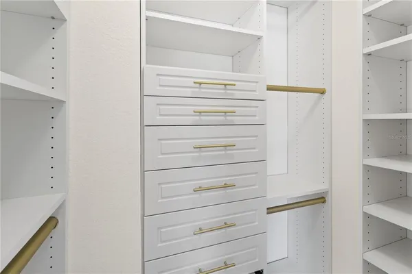 a bathroom with a granite countertop sink a toilet and a mirror