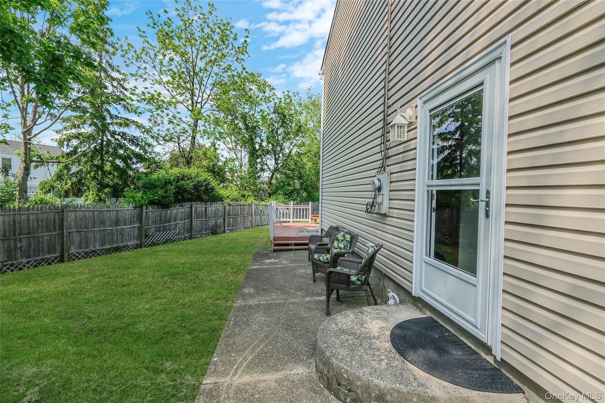 59 Maybrook Road North Babylon, NY 11703 - Photo 40 of 43 a view of a backyard with plants and a patio