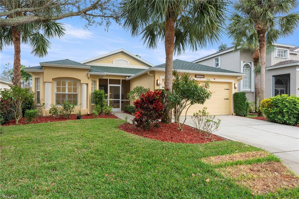 21695 Brixham Run Loop Estero, FL 33928 - Photo 1 of 32 a front view of house with yard and green space
