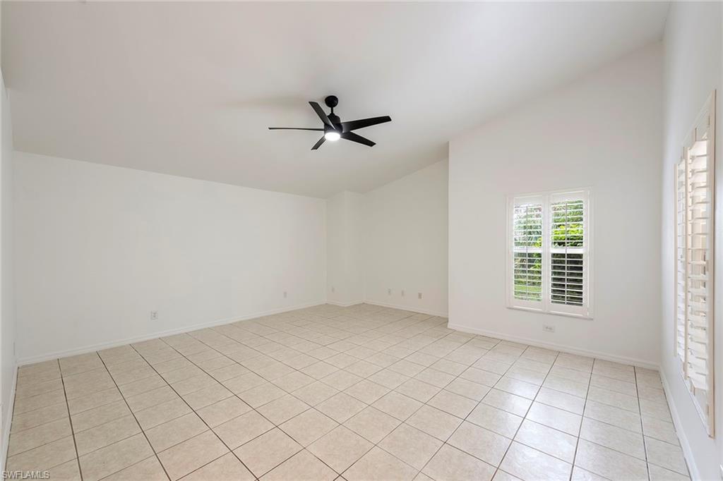 21695 Brixham Run Loop Estero, FL 33928 - Photo 13 of 32 an empty room with windows and fan